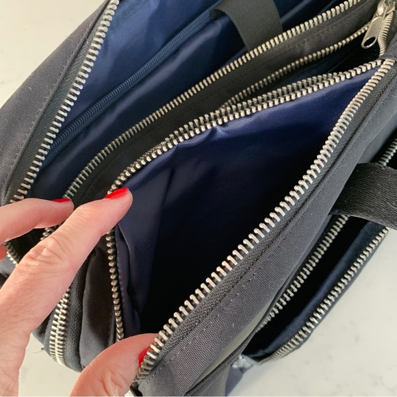 Black Travel Bag with Structured Design and Metal Feet - Picture 7 of 16